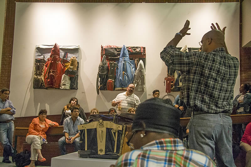Charles McGill speaks to students, staff and faculty at opening reception for Cross Section at the NCC Art Gallery.