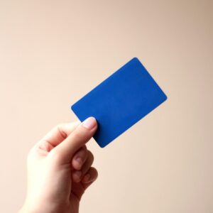 Hand holding blue card
